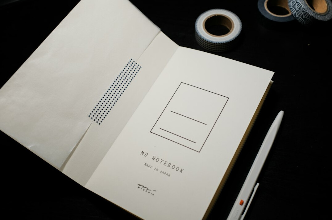 Notebook and pen on a desk