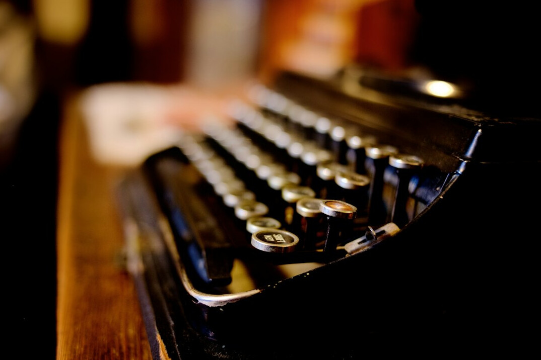 Vintage typewriter on a wooden desk