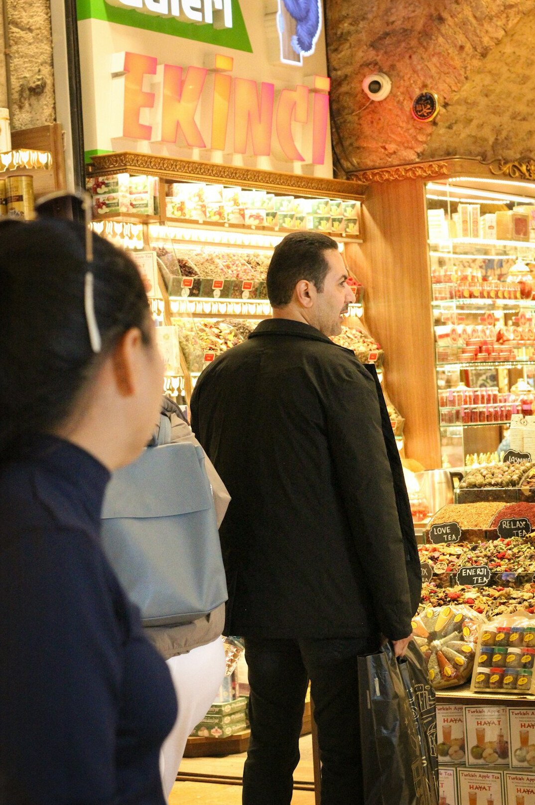store detective watching shoppers